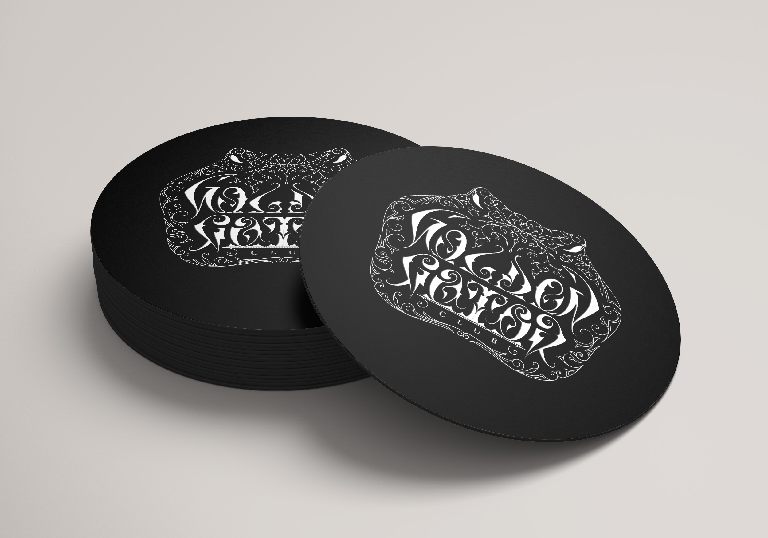 Black Coaster branded with a White Golden Gator Victorian Ambigram Logo