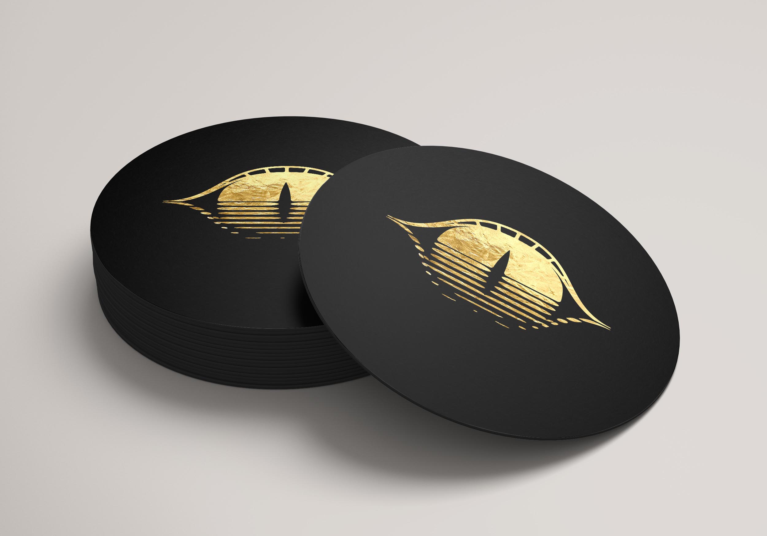 Black Coaster branded with a gold Golden Gator Gate Logo