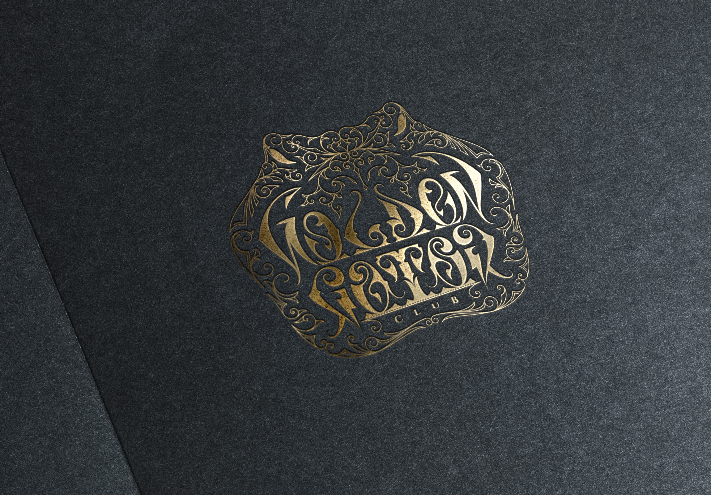 Golden Gator Victorian Ambigram Logo stamped in gold foil on black carboard